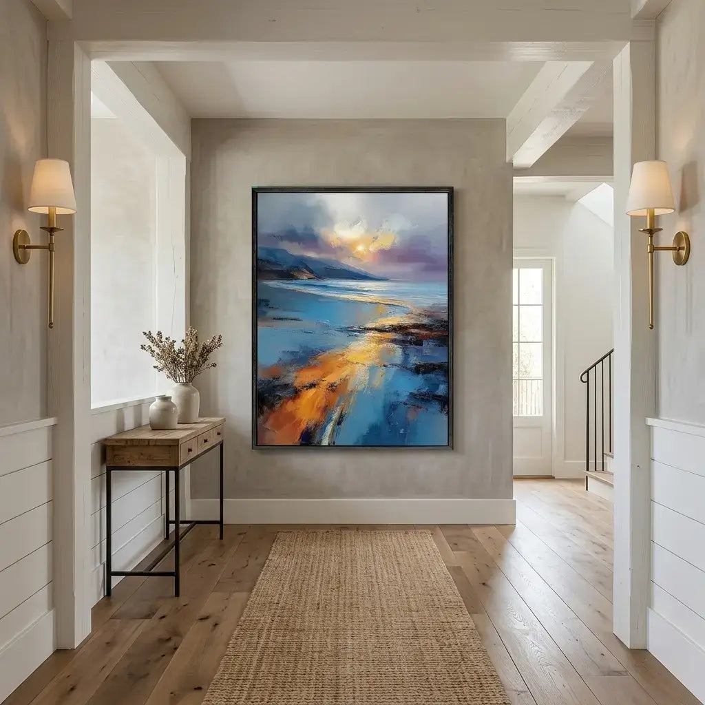 Modern hallway with abstract painting on the wall, side table, and lamps.