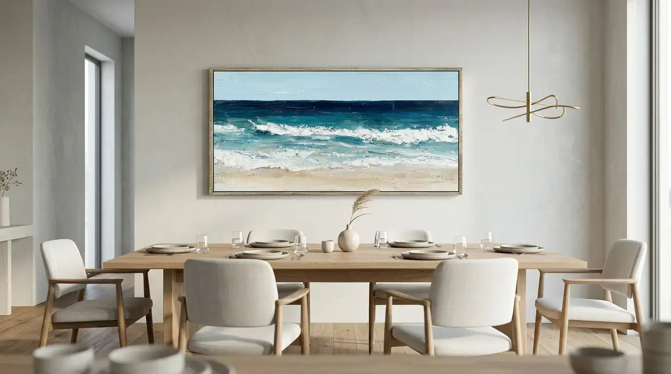 Dining room with a large framed beach scene on the wall