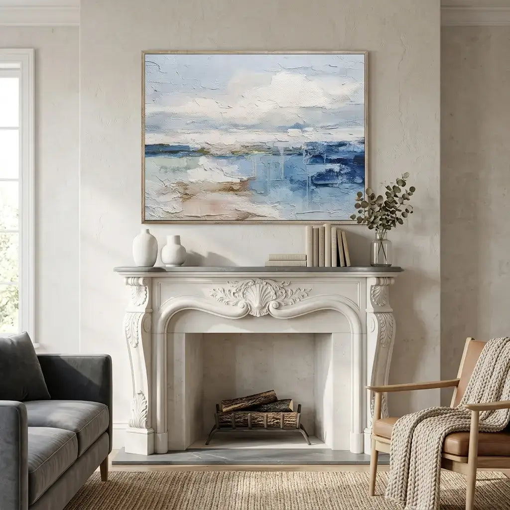 Living room with a fireplace, sofa, chair, and abstract painting above the mantel.