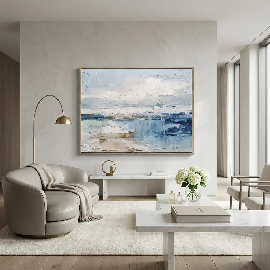 Modern living room with a large abstract painting on the wall, a sofa, and a coffee table.