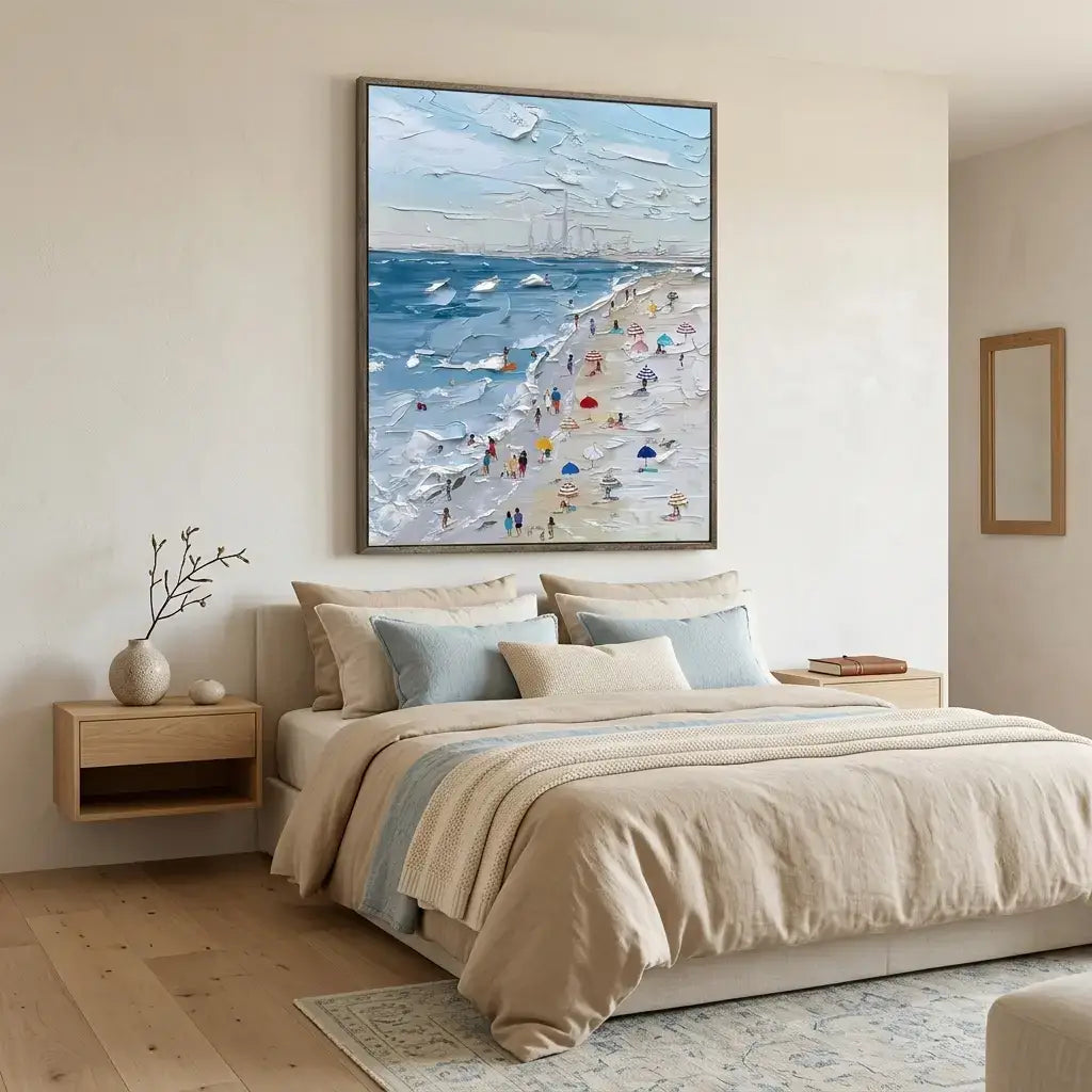 Bedroom with a large framed beach scene painting above a bed.