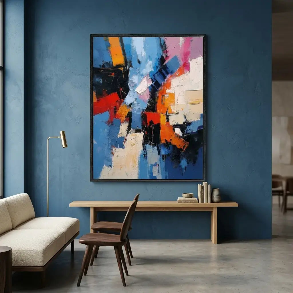 Modern interior with abstract art on a blue wall, sofa, and table.