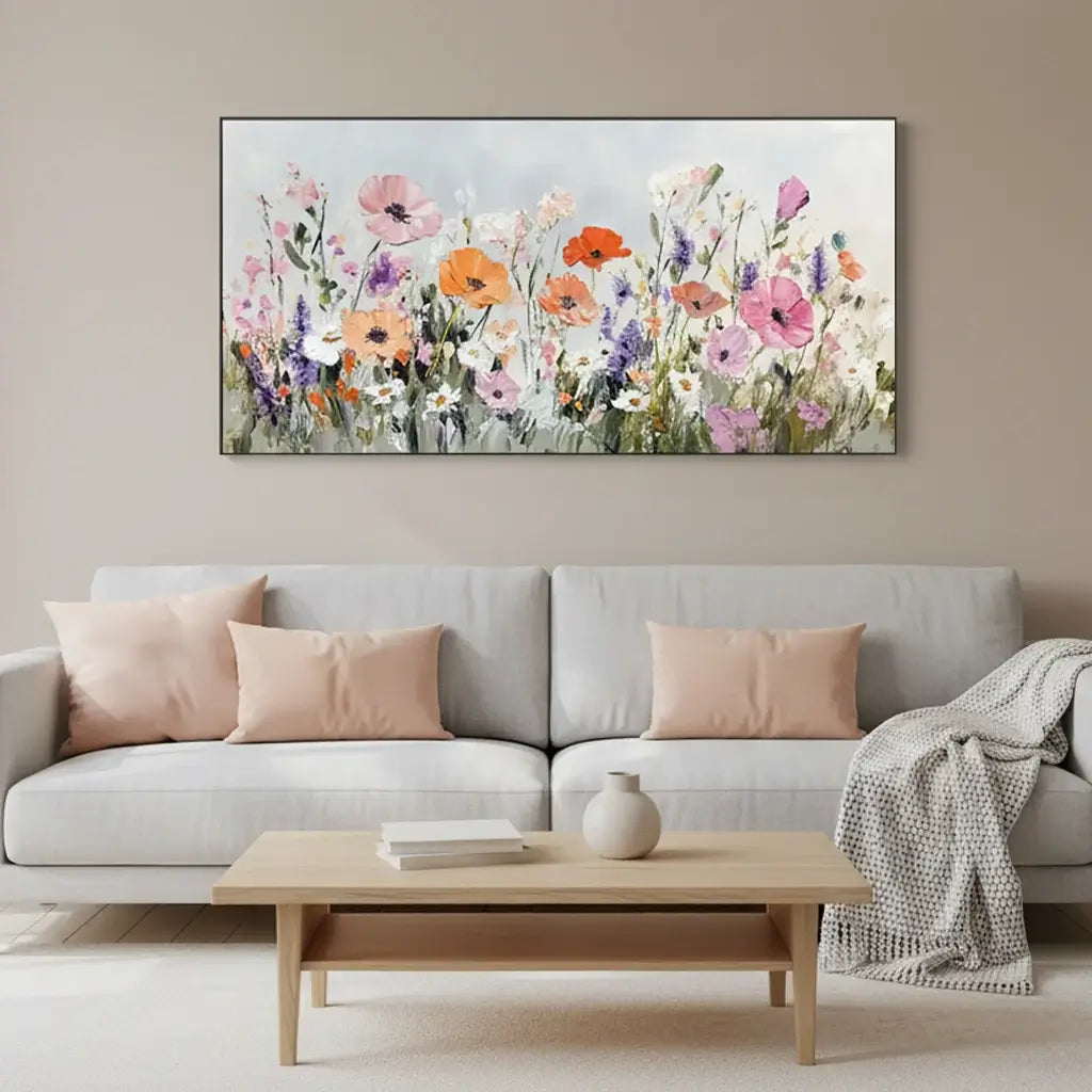 Living room with a floral painting above a gray sofa and wooden coffee table.