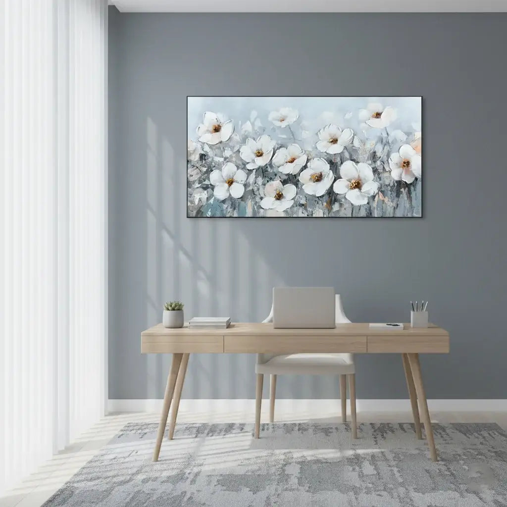 Modern office setup with a desk and chair, and a floral painting on the wall.