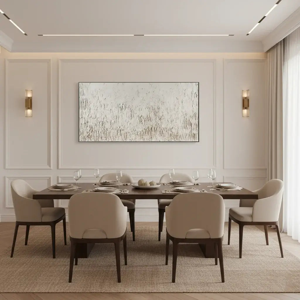 Modern dining room with a long table and chairs, abstract painting on the wall, and decorative elements.
