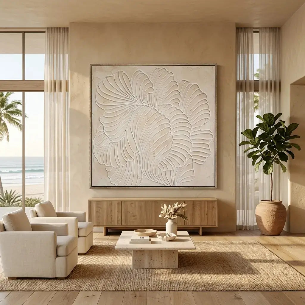 Modern living room with beige walls, a large abstract painting, and a view of the ocean.