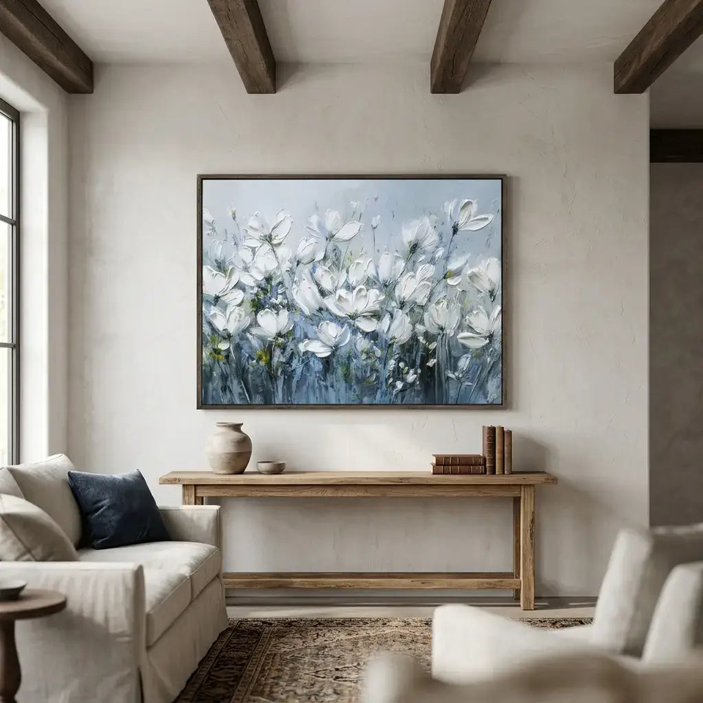 Living room with a floral painting on the wall, a wooden coffee table, and a beige sofa.