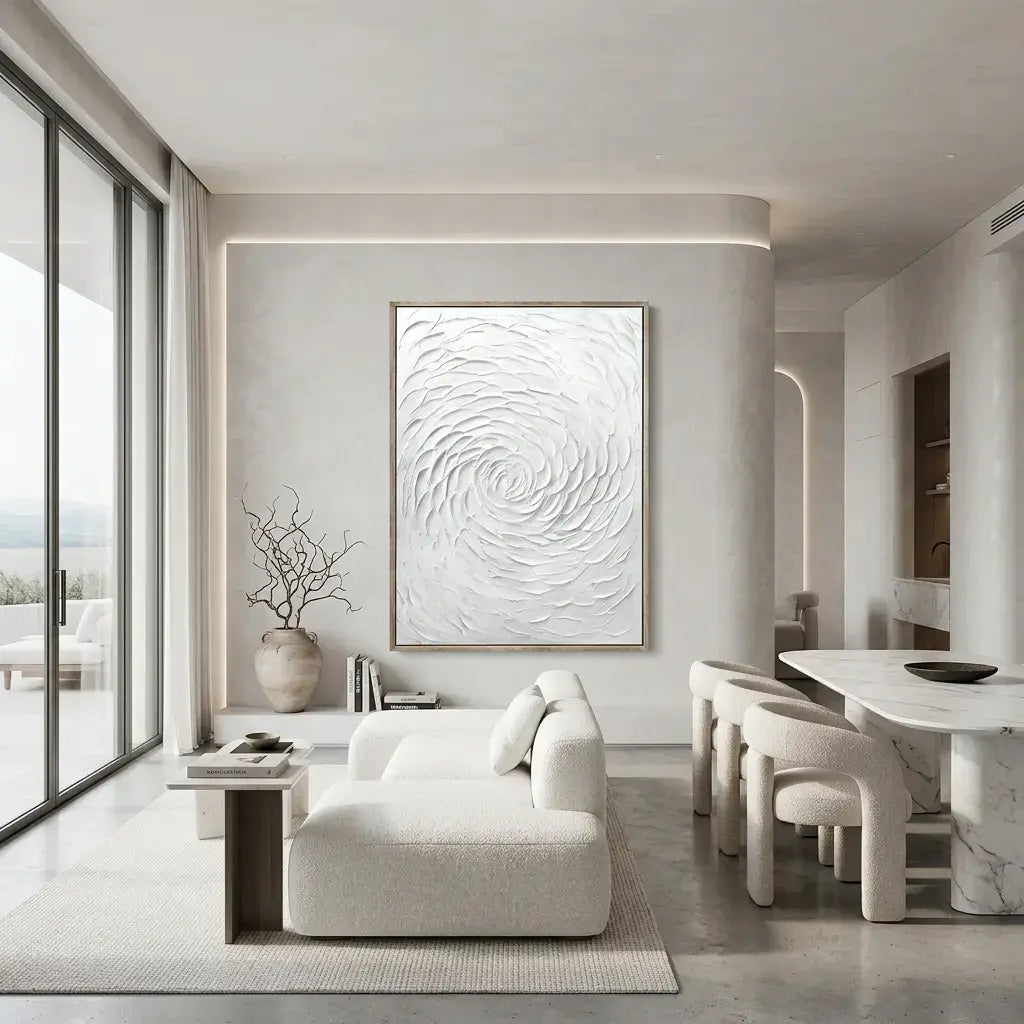 Modern living room with a large abstract painting on the wall, white sofa, and dining area.
