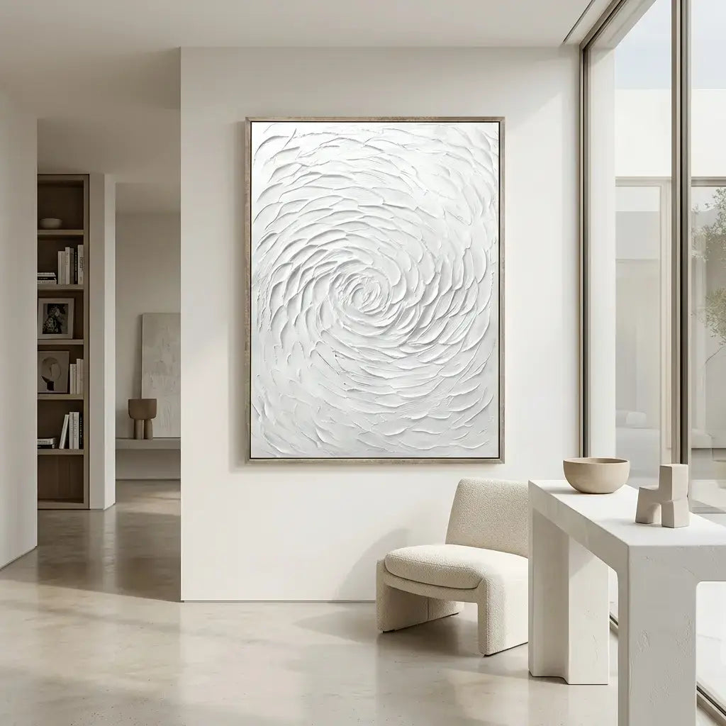 Modern interior with a large abstract white painting on a wall.