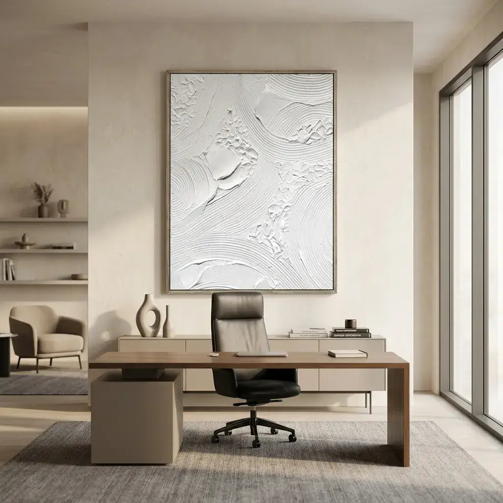 Modern office interior with a desk, chair, and abstract wall art.