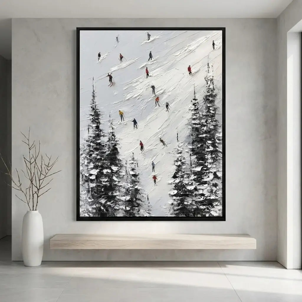 Framed artwork of skiers on a snowy slope with trees, hanging on a wall above a wooden shelf.