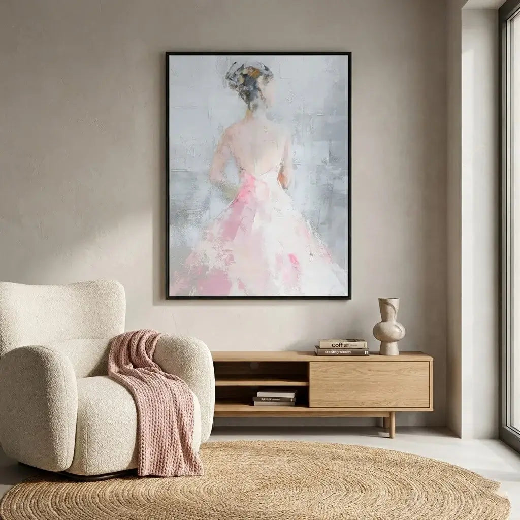 Modern living room with a large abstract painting of a woman in a pink dress, a beige armchair with a pink blanket, and a wooden side table.