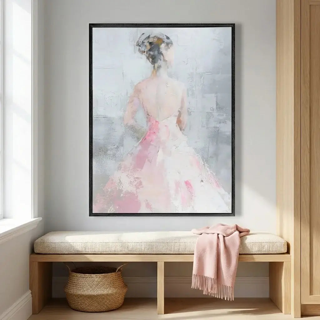 Framed abstract art of a woman in a pink dress on a wall above a wooden bench.