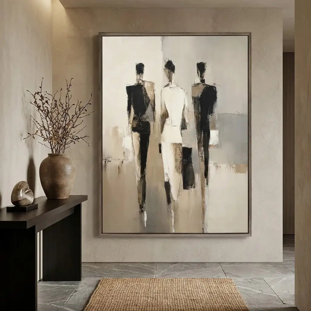 Abstract art piece of three figures in a modern interior setting.