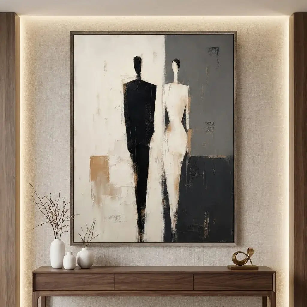 Abstract painting of two figures on a wall above a wooden console table.