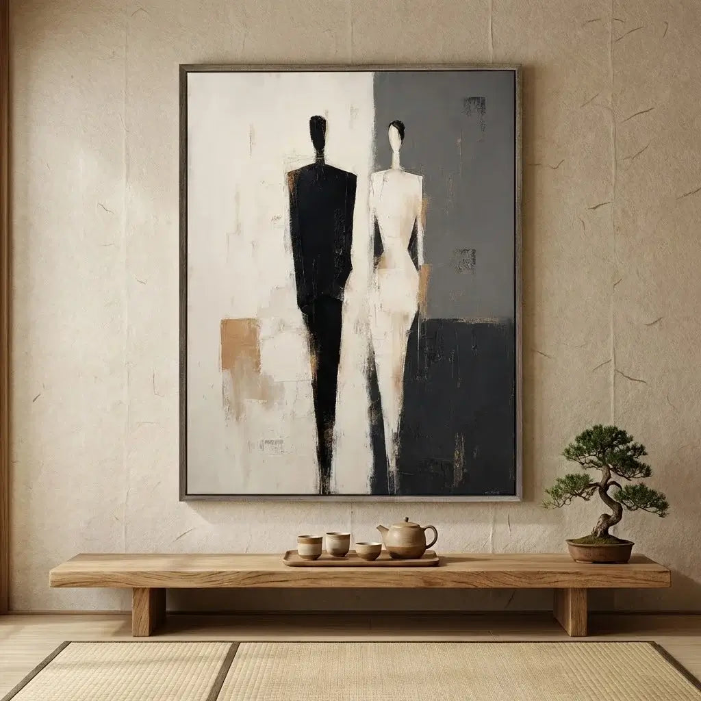 Abstract painting of two figures on a wall above a wooden bench with tea set and bonsai tree.