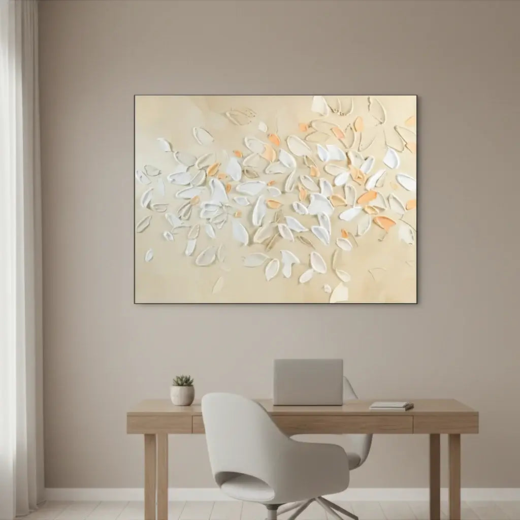 Abstract painting on a wall above a desk with a chair and laptop.