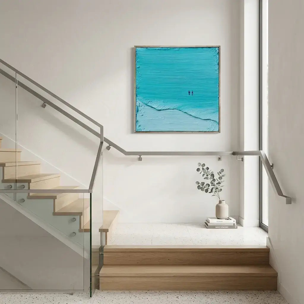 Modern interior with a staircase and a blue abstract painting on the wall.