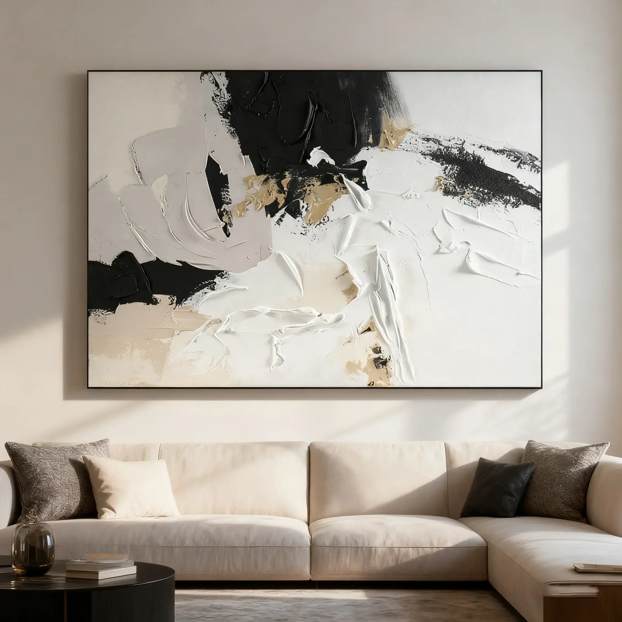 Abstract art piece on a wall above a beige sofa