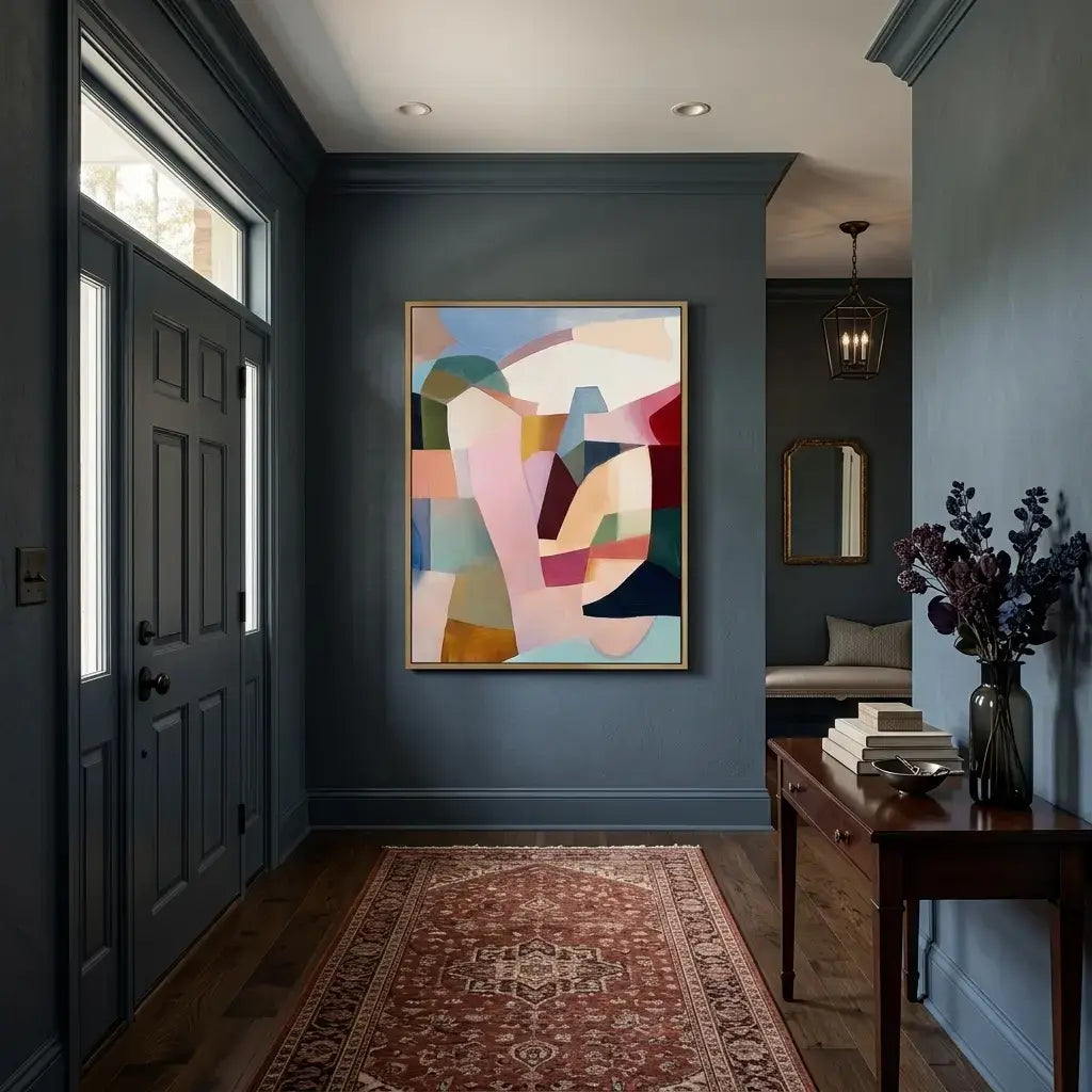 Modern interior hallway with abstract art, a rug, and a side table.