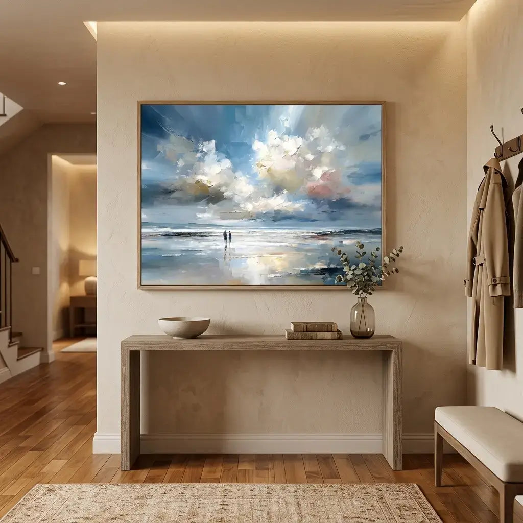 Modern interior with a large abstract painting of a beach scene on a wall above a console table.