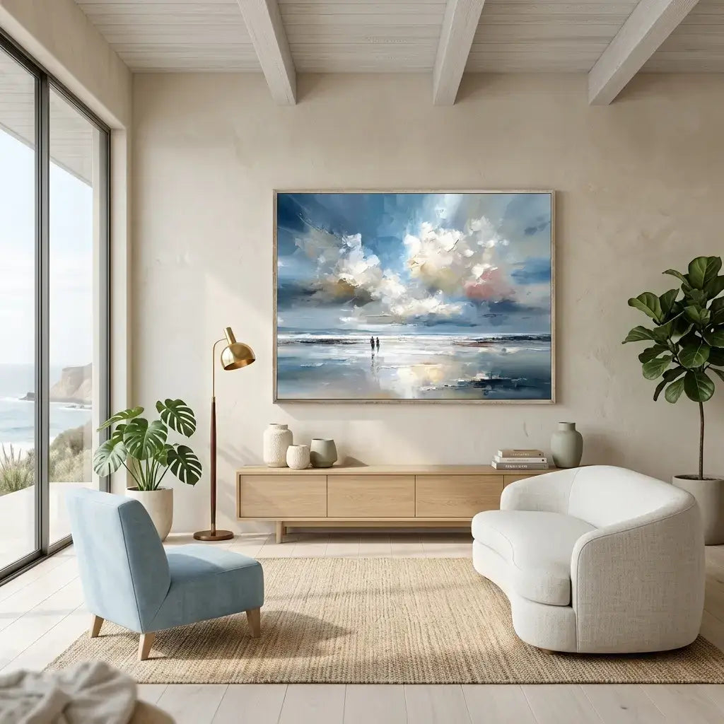 Modern living room with a large ocean wall art, white sofa, and blue armchair.