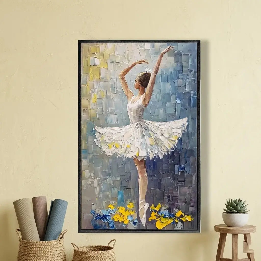 Framed artwork of a ballerina in a white dress with floral details on a yellow wall.