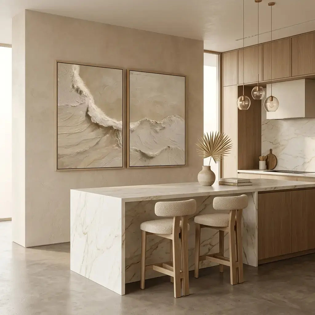Modern kitchen with marble island, bar stools, and abstract wall art.