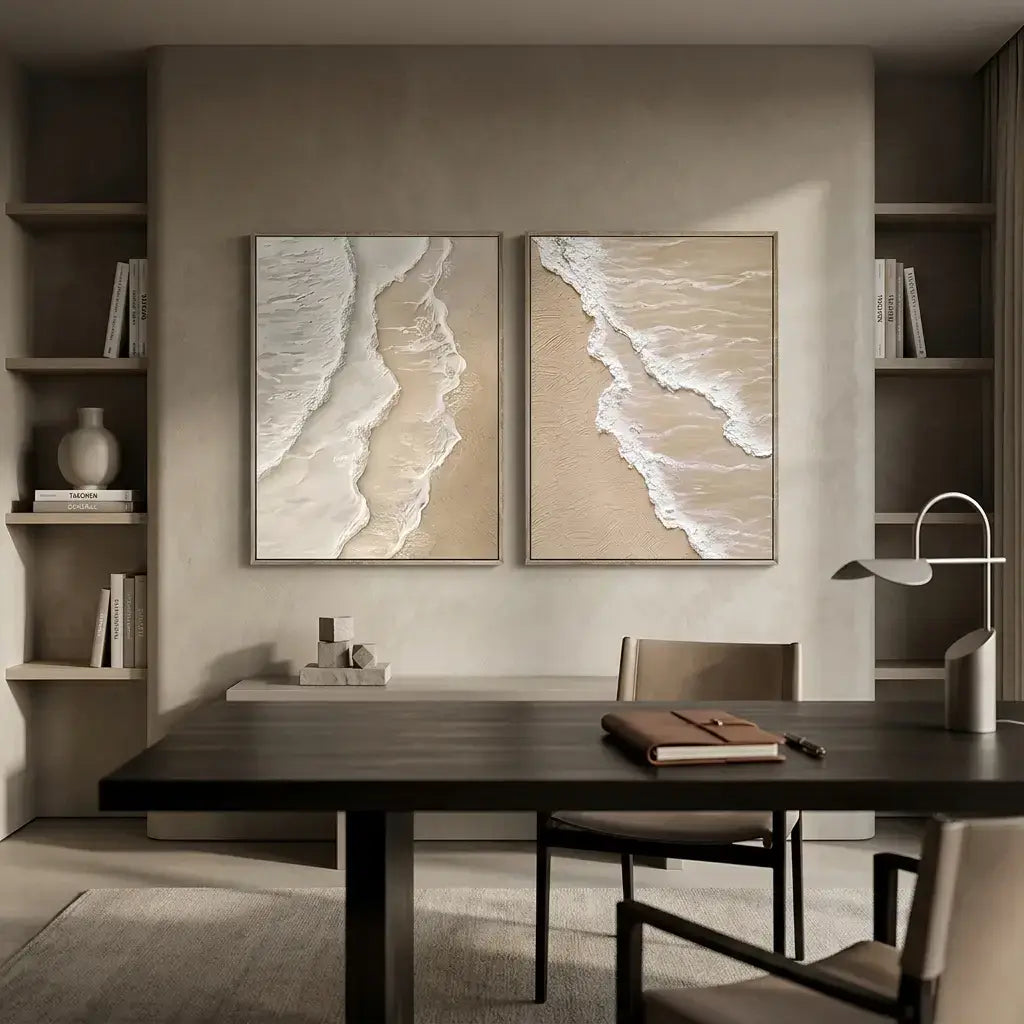 Modern interior with a dining table and chairs, featuring two beach-themed wall art pieces.