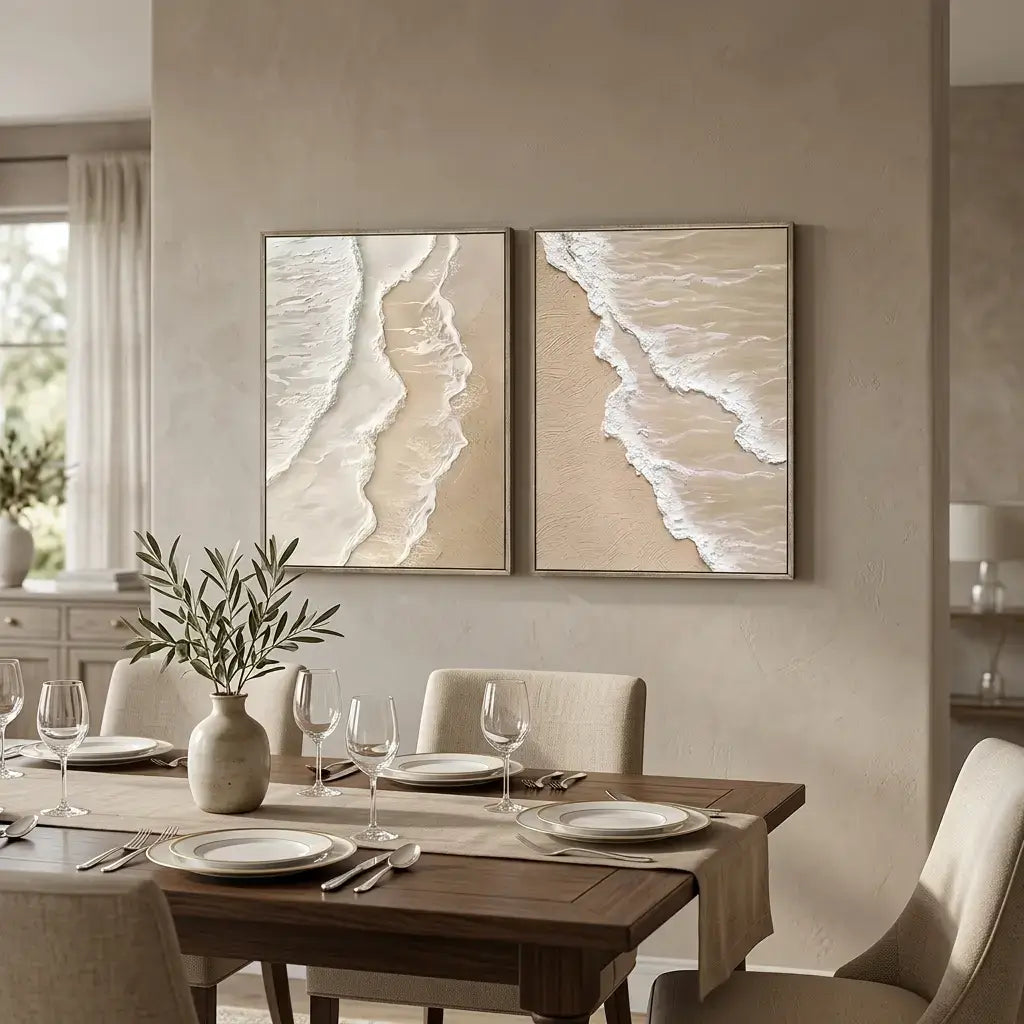 Dining room with a set table and two beach-themed wall art pieces.