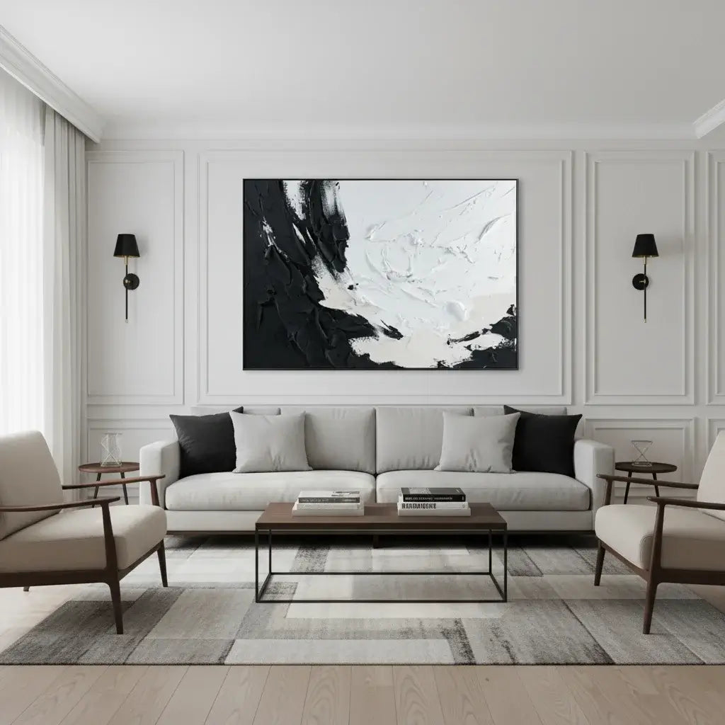 Modern living room with a gray sofa, coffee table, and abstract art on the wall.