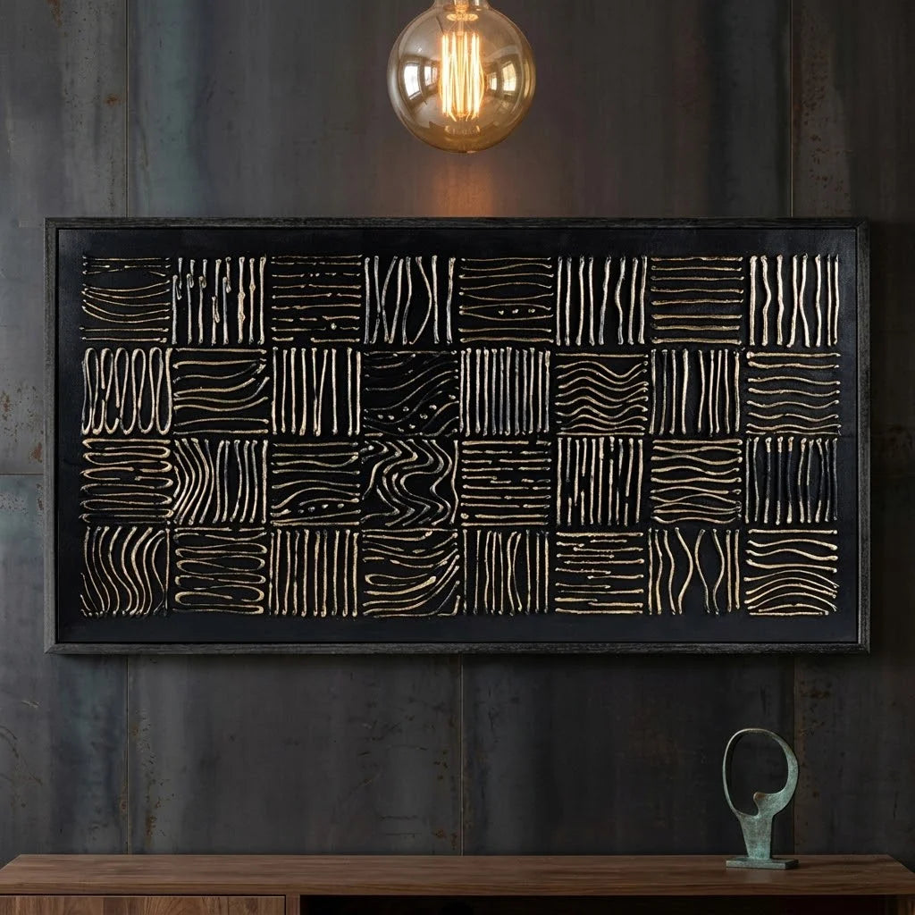 Decorative wall art with geometric patterns above a wooden desk.