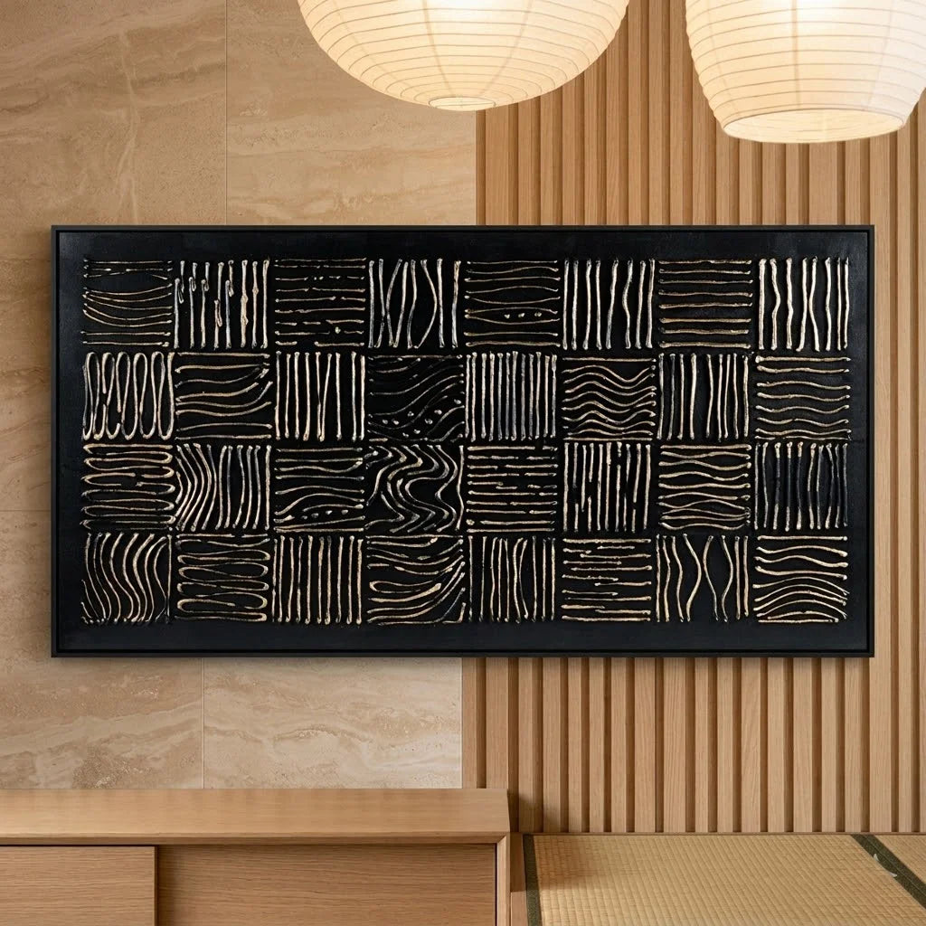 Abstract wall art with geometric patterns in a modern interior setting.