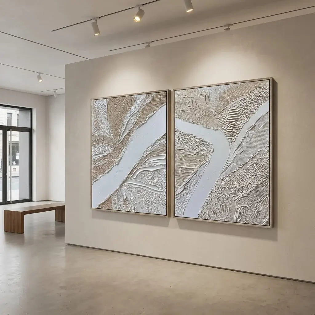 Two abstract artworks on a wall in a modern interior setting.