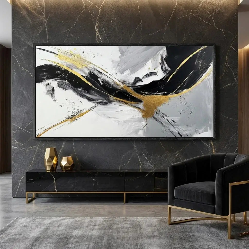 Modern living room with abstract art on the wall, black sofa, and marble accents.