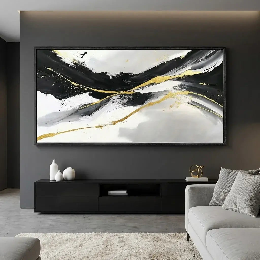 Modern living room with abstract painting on wall, black TV stand, and gray sofa.