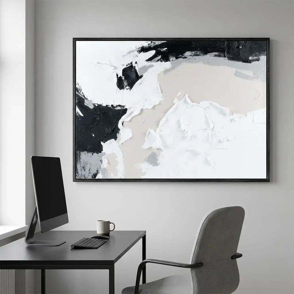 Modern office setup with a desk, chair, and abstract art on the wall.