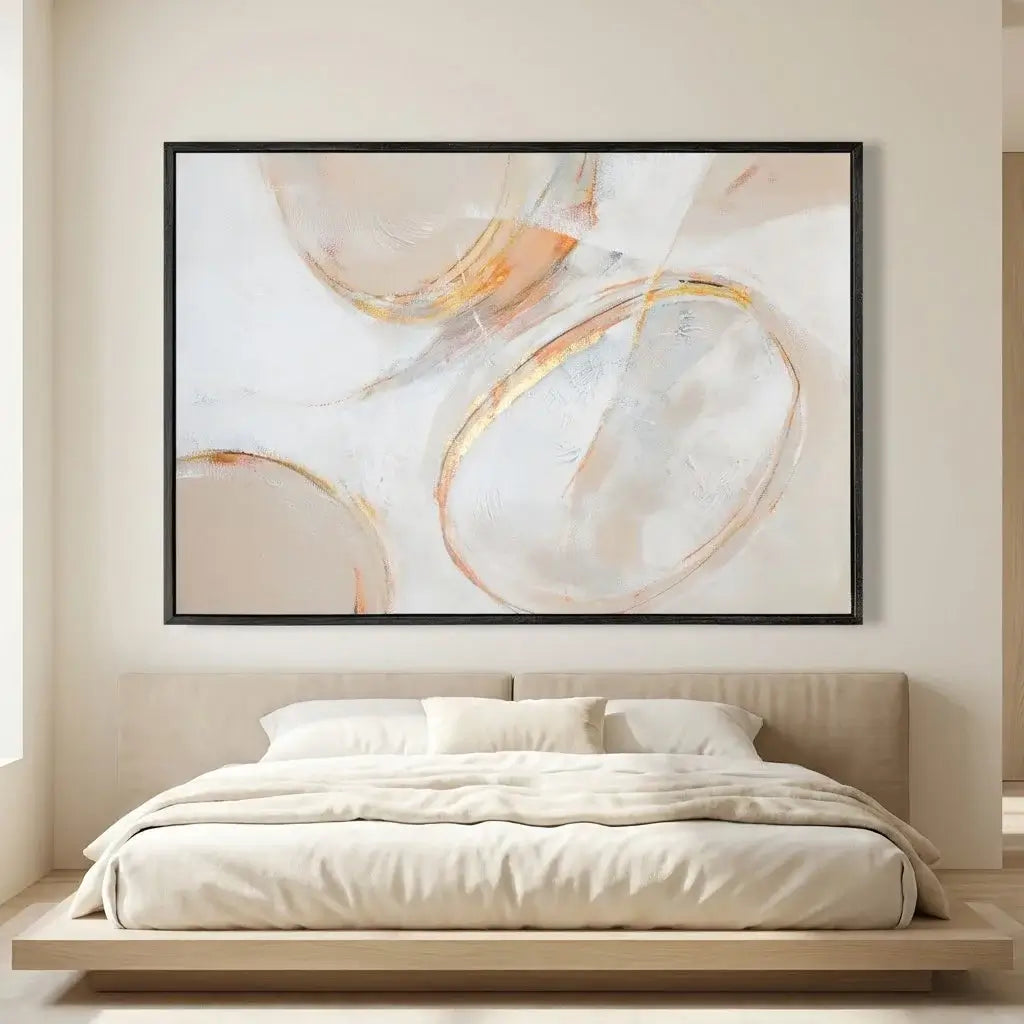 Abstract art piece on a wall above a bed in a bedroom setting