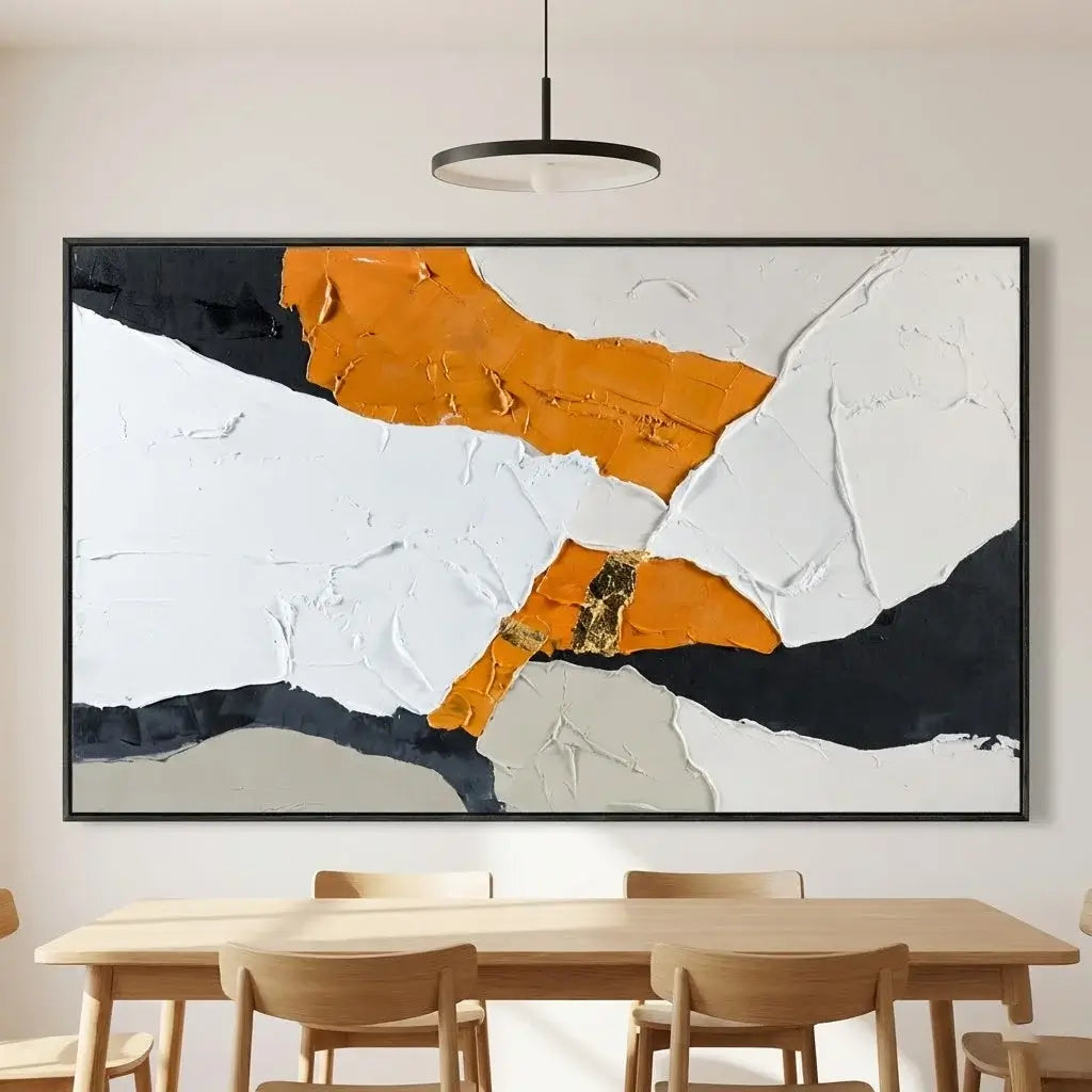 Abstract art piece with orange, black, and white colors in a modern interior setting.