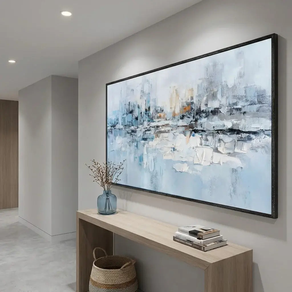 Modern interior with abstract art on the wall above a console table.