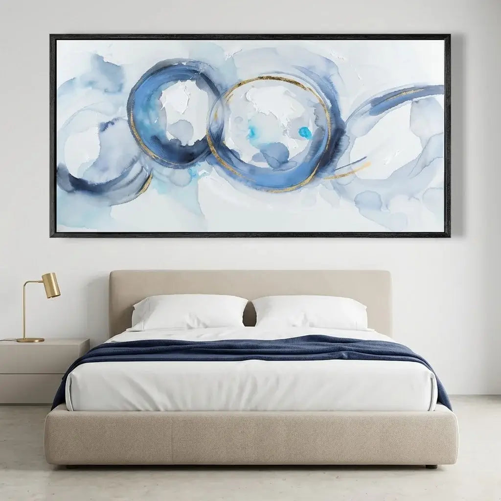 Modern bedroom with a bed and abstract artwork on the wall