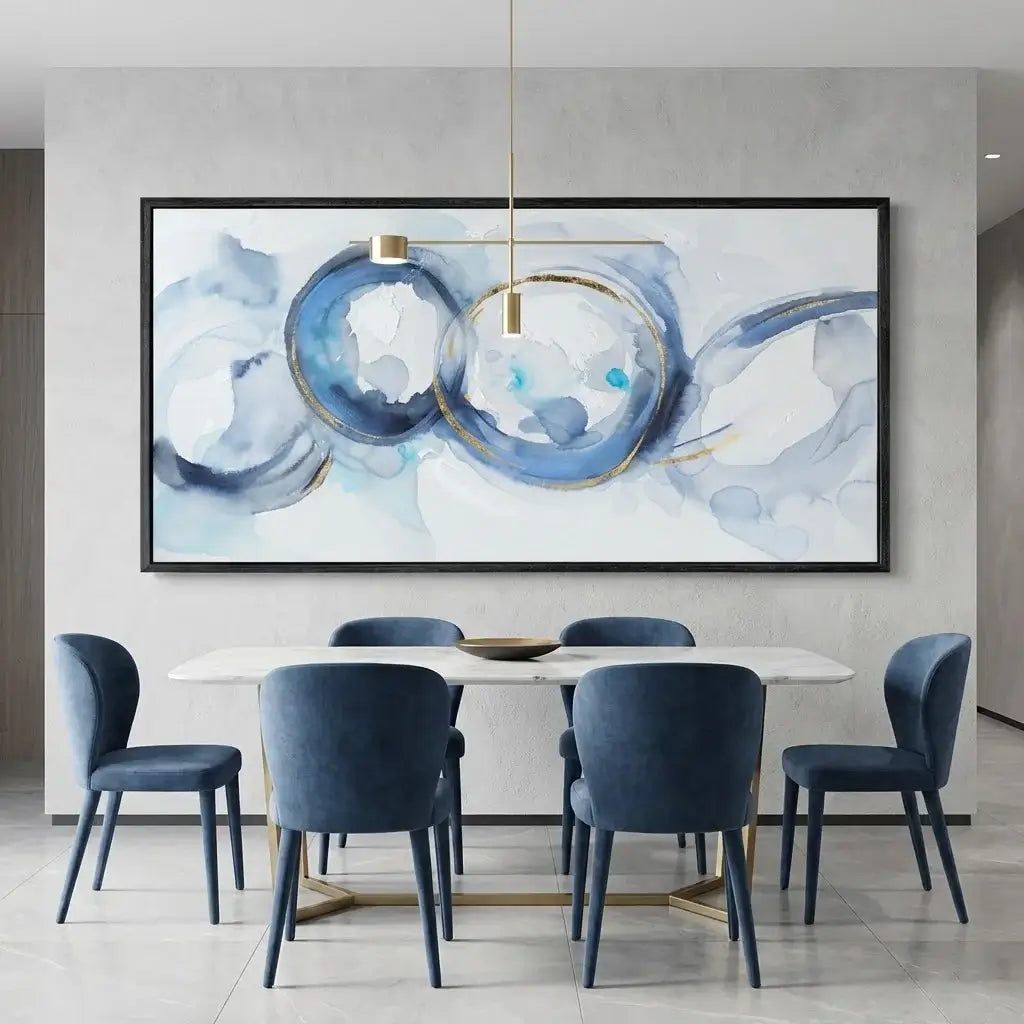 Dining room with blue chairs around a table, featuring a large abstract painting on the wall.