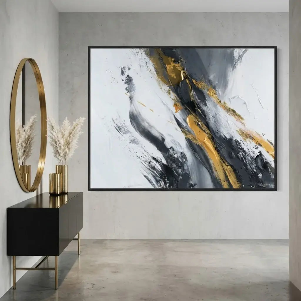 Modern interior with abstract art, round mirror, and decorative items.