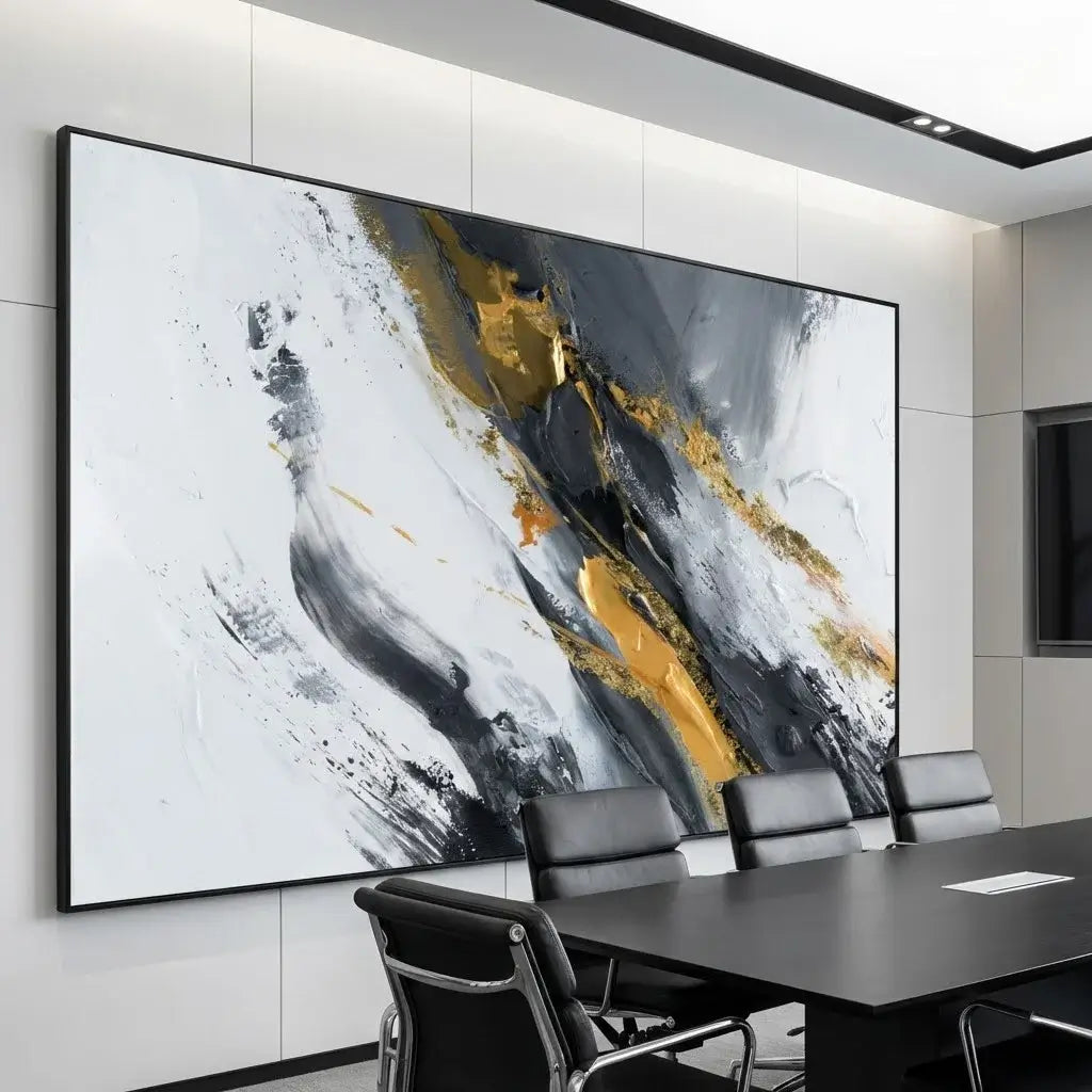 Abstract art piece with gold and black accents in a modern office setting.