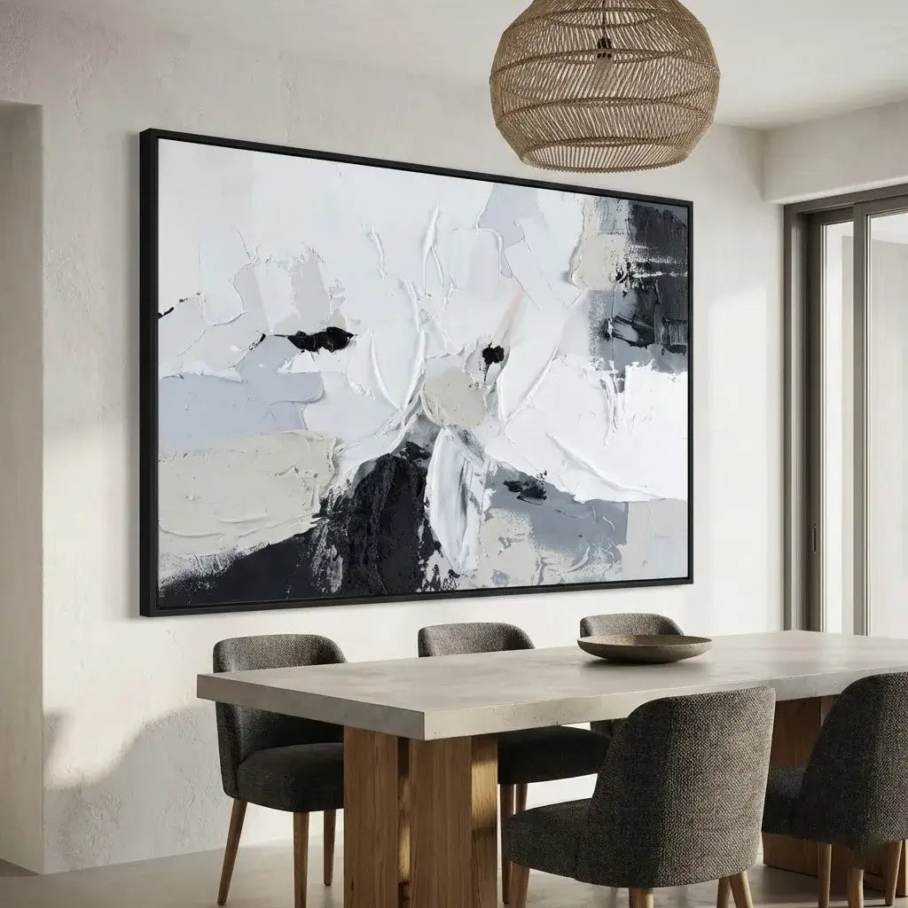 Dining room with abstract art on the wall, table, and chairs.