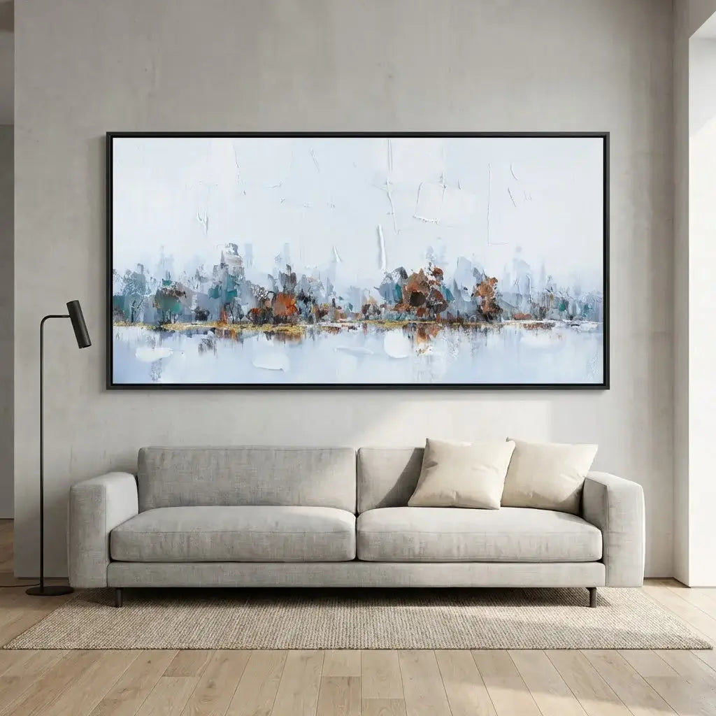 Modern living room with a gray sofa and abstract painting on the wall.