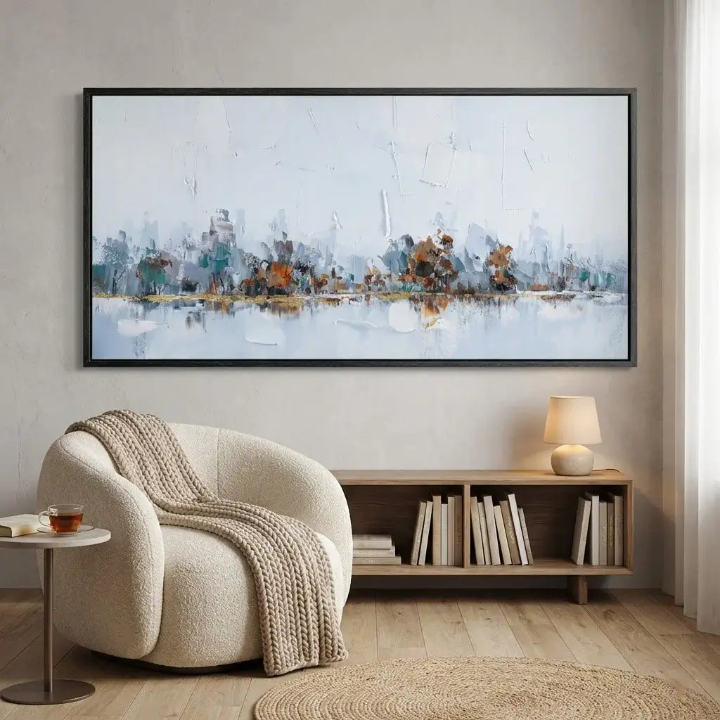 Modern living room with a cityscape painting, armchair, and bookshelf.