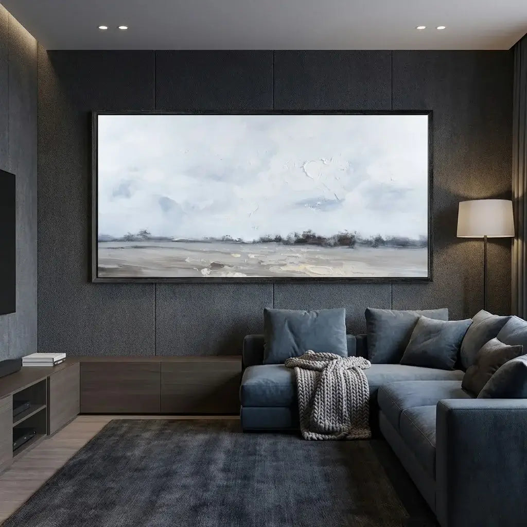Modern living room with a large flat-screen TV displaying a landscape, gray walls, and a gray sofa.