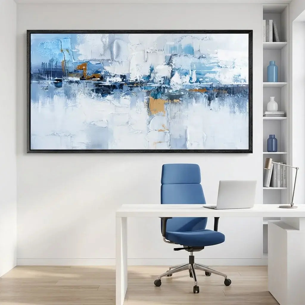 Modern office setup with a large abstract painting, desk, chair, and shelves.