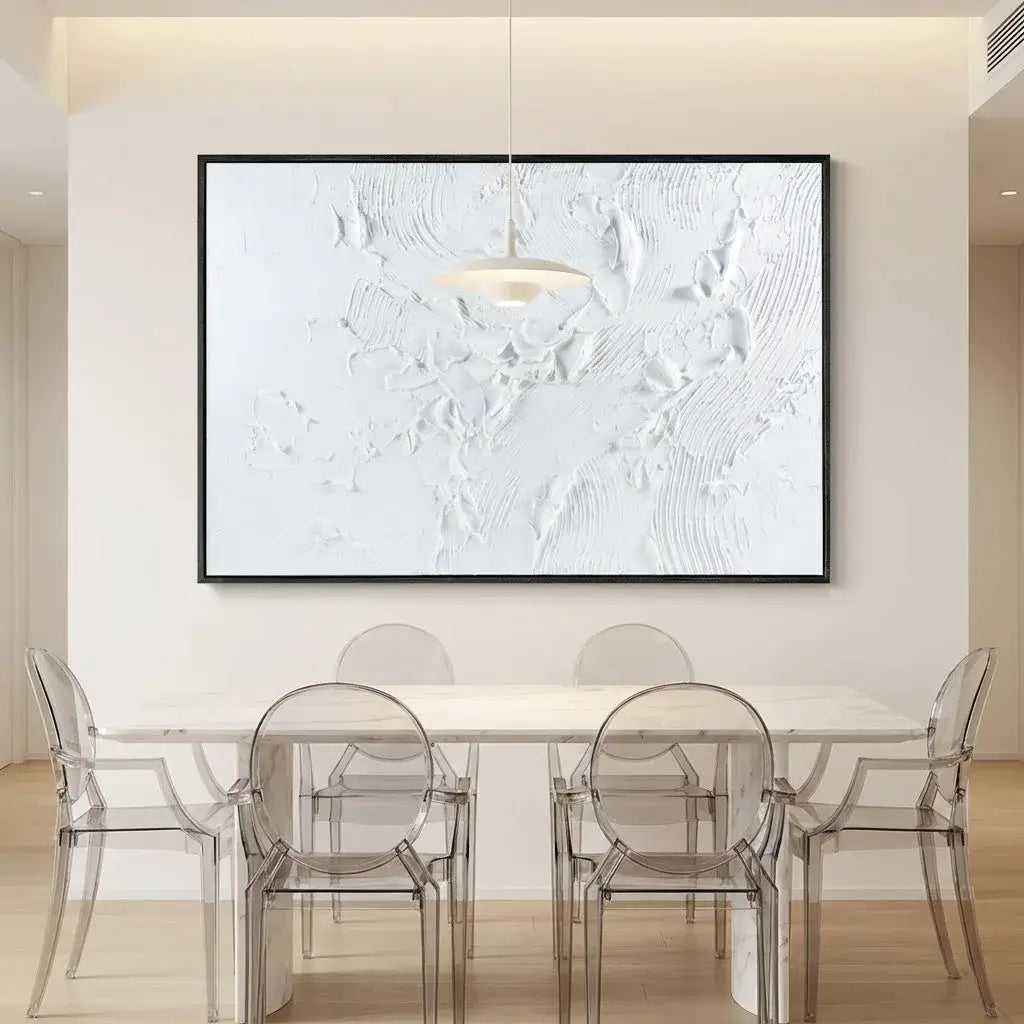 Modern dining room with a large abstract painting on the wall, clear glass table, and chairs.